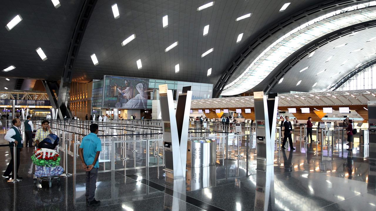 Passengers walk through the Hamad International Airport in Doha, Qatar on June 7, 2017. Picture: AFP.