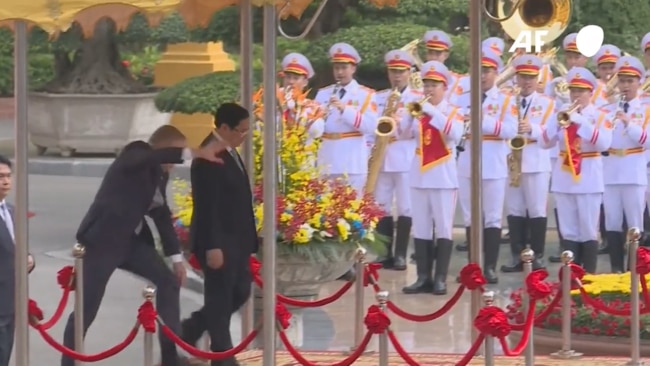 Prime Minister Anthony Albanese loses his footing while reviewing a guard of honour with Vietnamese Prime Minister Pham Minh Chinh at the Presidential Palace in Hanoi.