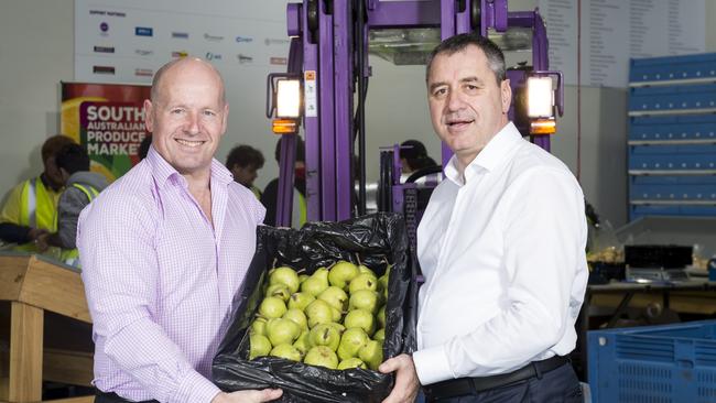 Foodbank SA chief executive Greg Pattinson with Angelo Demasi, chief executive of the SA Produce Market.