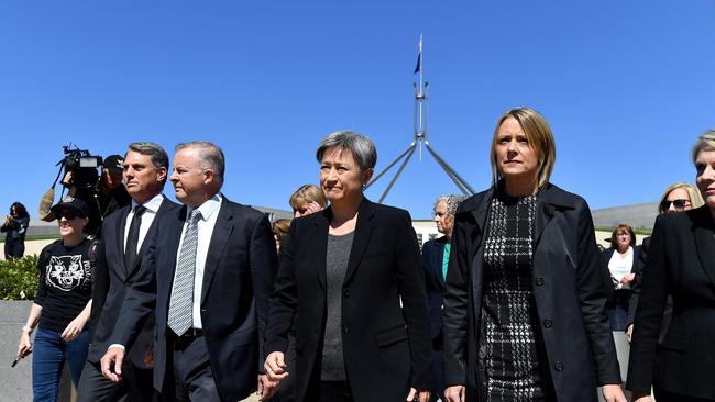 Australian Labor Party leader Anthony Albanese, deputy leader Richard Marles, senators Penny Wong and Kristina Keneally leave the Parliament House building to join a protest against sexual violence and gender inequality in Canberra on March 15. Picture: AFP