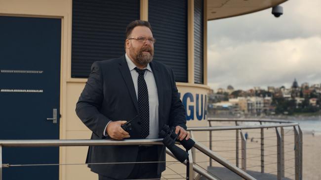 Adrian Butler (Clayton Jacobson) at the lifeguard tower on Bondi Beach in Top of the Lake.