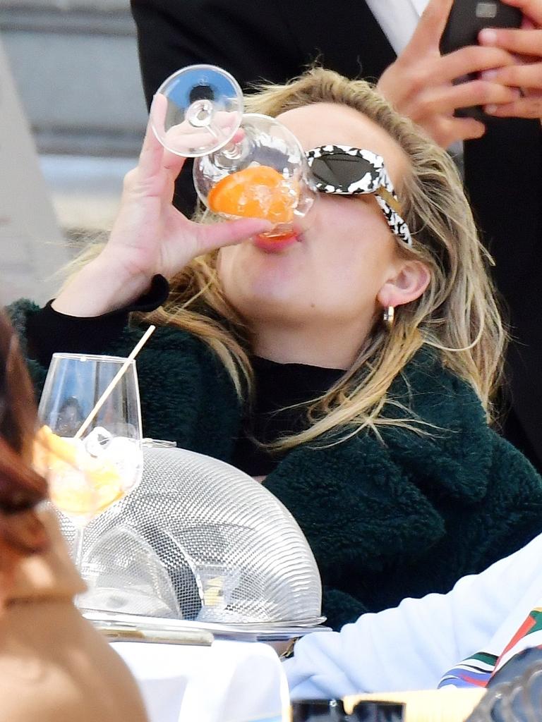 She also posted this photo of herself ‘sculling’ an Aperol in Italy. Picture: Backgrid