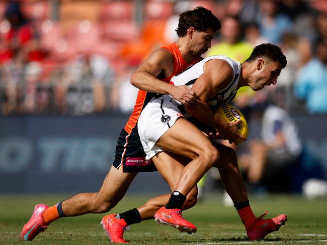 Toby Bedford takes down Nick Daicos in Opening Round. Picture: Dylan Burns/AFL Photos