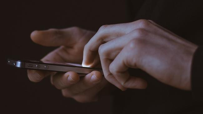 Generic image of man using mobile phone in the dark. Picture: Pixabay