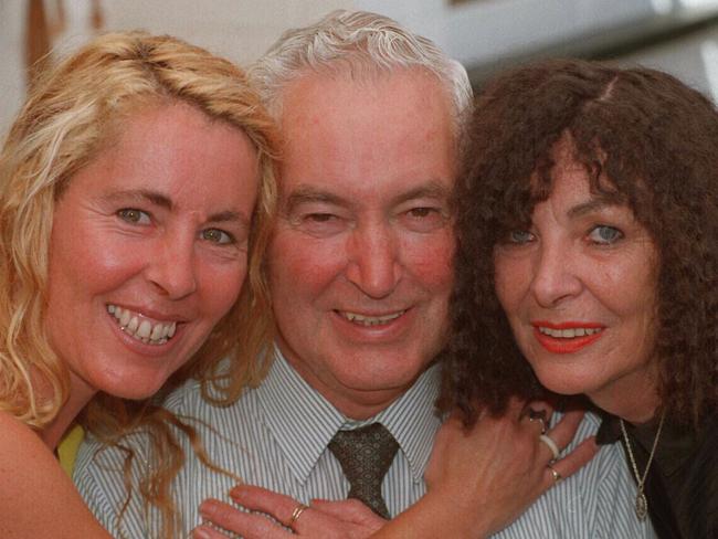 Bruce Goodluck and daughter Catherine Rafter, left, and wife Cynthia.