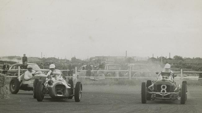 Lex Davison in a Jaguar, Ted Gray in an Alta Ford and Jack Brabham in a Cooper Bristol vie for position in a March 22, 1954 race at Fishermans Bend. Picture: Victorian Historic Racing Archive, State Library