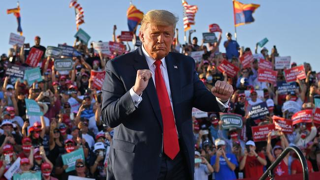 Donald Trump dances as he leaves a rally at Tucson International Airport in Arizona. Picture: AFP