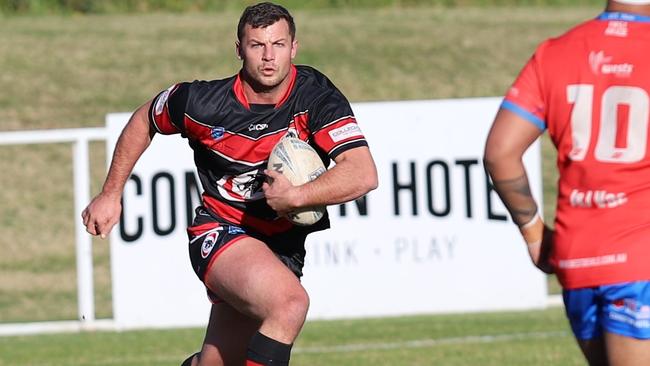 Captain Blake Phillips runs the ball back for Collegians. Picture: Steve Montgomery