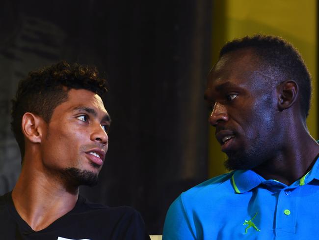 Wayde Van Niekerk shares some time with Usain Bolt.