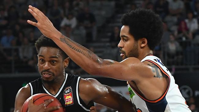 MELBOURNE, AUSTRALIA — NOVEMBER 11: Casper Ware of United dribbles the ball past Melo Trimble of the Taipans during the round five NBL match between Melbourne United and the Cairns Taipans at Hisense Arena on November 11, 2018 in Melbourne, Australia. (Photo by Quinn Rooney/Getty Images)