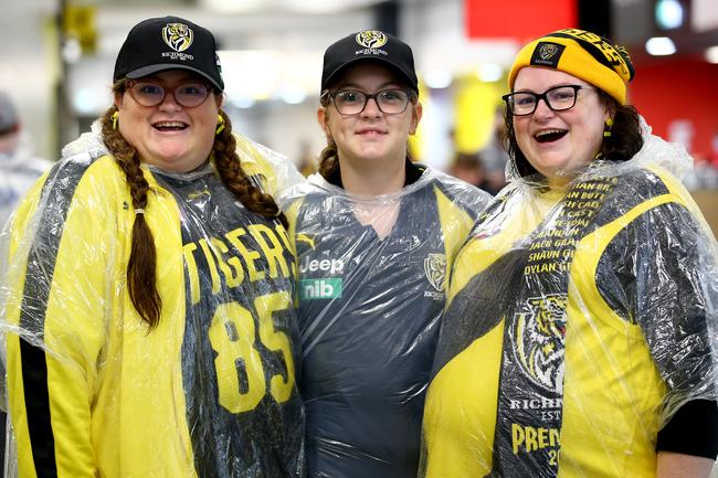 BRISBANE, AUSTRALIA - OCTOBER 24: Richmond fans pose before the 2020 AFL Grand Final match between the Richmond Tigers and the Geelong Cats at The Gabba on October 24, 2020 in Brisbane, Australia. (Photo by Jono Searle/AFL Photos/via Getty Images)