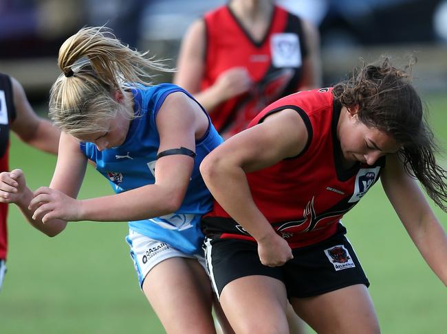 VFL (state league) women's footy: Knox v VU Western Spurs, at Schultz Reserve, Cassandra Papadopoulos, 16, Wantirna, Knox, (red) & Ainslie Kemp, 36, VU Western Spurs, Picture Yuri Kouzmin