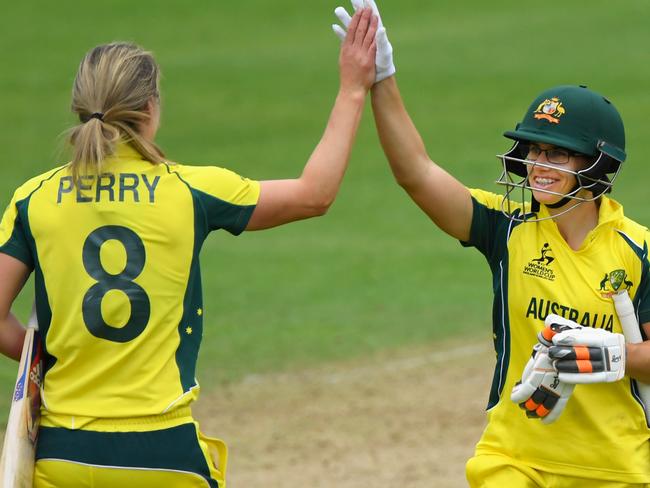 TAUNTON, ENGLAND - JUNE 26:  Australia batsman Nicole Bolton (r) and  Ellyse Perry celebrate victory during the ICC Women's World Cup 2017 match between Australia and West Indies at The Cooper Associates County Ground on June 26, 2017 in Taunton, England.  (Photo by Stu Forster/Getty Images)