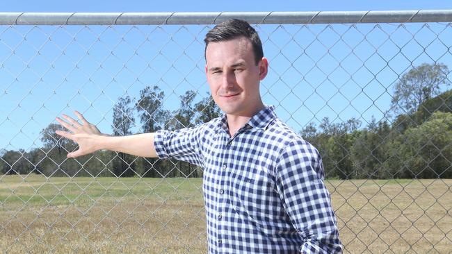 Sam O'Connor at the Helensvale Glink station — he and Transport Minister Mark Bailey are in dispute about funding.