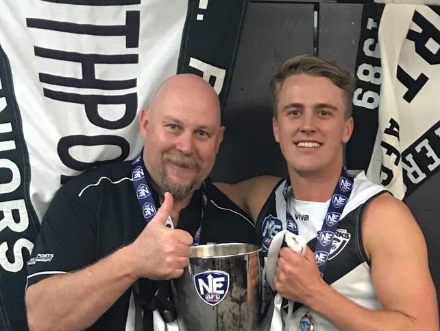 Southport Sharks coach Steve Daniel and player Michael Manteit celebrate the 2018 NEAFL premiership in their first season at the club. Picture: Southport Sharks.