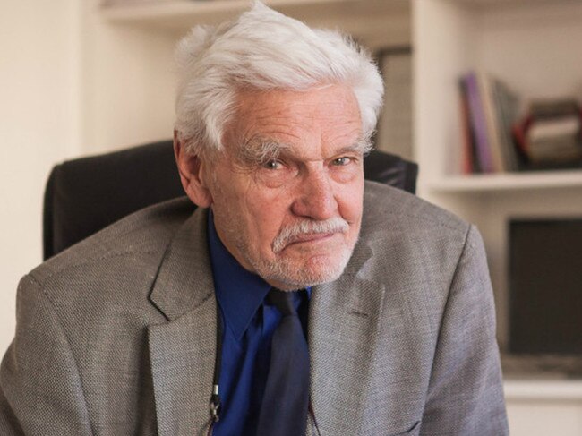 Dr Rodney Syme at his desk