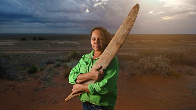 Mithaka elder Trudy Gorringe with one of two rare rainforest swords discovered in the mud near Bedourie in far-west Queensland. Picture: Lyndon Mechielsen