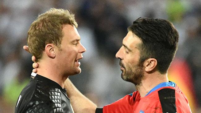 Italy's goalkeeper Gianluigi Buffon (L) congratulates Germany's goalkeeper Manuel Neuer.