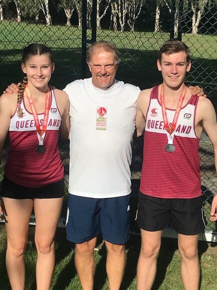 Hammer throwers Lara and Benjamin Roberts with their coach Brett Green.