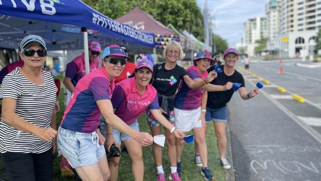 Tri-Activ8, a racing team from Mackay, were all dressed in their pink uniforms to cheer on their 15 competitors across both races. Nikki Giles joins her team in cheering. Picture: Kristina Puljak