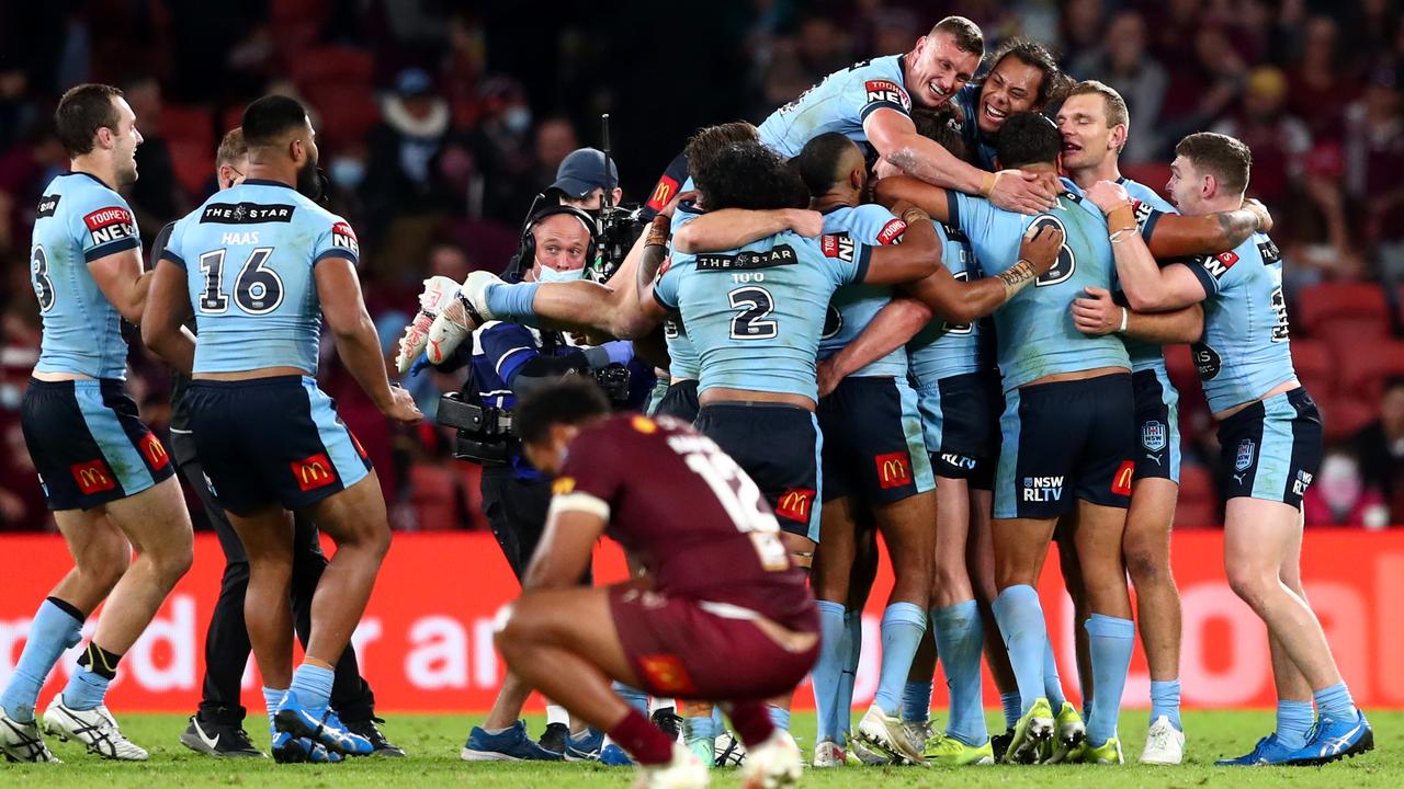 The Blues celebrate and the Maroons commiserate.