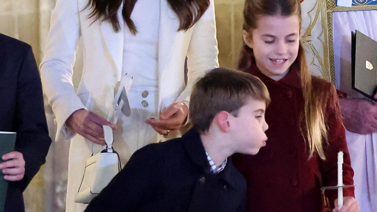 But he couldn’t resist blowing out his sister’s candle. Picture: Chris Jackson/Pool/AFP