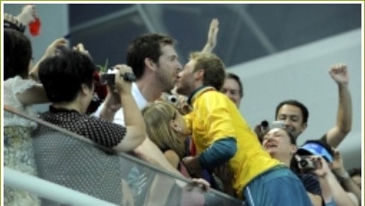 Matthew Mitcham embraces his partner, Lachlan Fletcher, after his gold medal win at the Beijing Olympics.