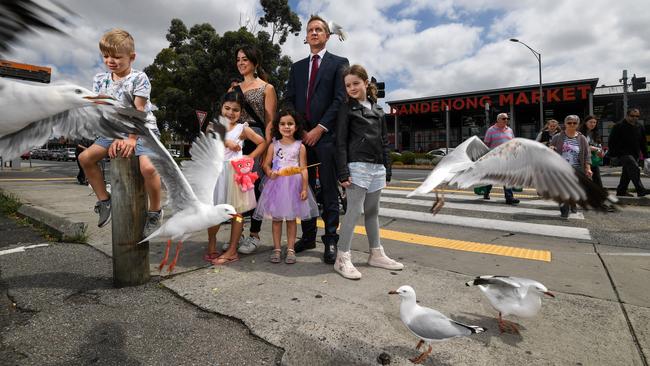 Bruce federal Labor MP Julian Hill with Joanna Kennedy and her kids Levi, Juliette, Sabine and Paras battle seagulls outside the Dandenong Market. Picture: Penny Stephens