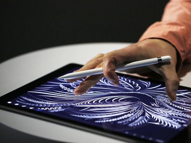 SAN FRANCISCO, CA - SEPTEMBER 9: A man uses the new Apple Pencil on an iPad Pro after an Apple special event at Bill Graham Civic Auditorium September 9, 2015 in San Francisco, California. Apple Inc. unveiled latest iterations of its smart phone, forecasted to be the 6S and 6S Plus and announced an update to its Apple TV set-top box. Stephen Lam/ Getty Images/AFP == FOR NEWSPAPERS, INTERNET, TELCOS & TELEVISION USE ONLY ==