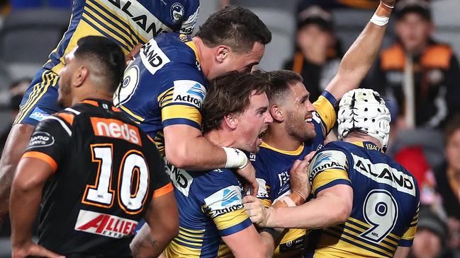 Will Smith was swamped by teammates after scoring the matchwinner for the Eels to secure a top four spot. Picture: Getty Images