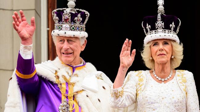 King Charles III and Queen Camilla wave to the crowds from the balcony of Buckingham Palace after their Coronation on May 06, 2023. Picture: Leon Neal/Getty Images