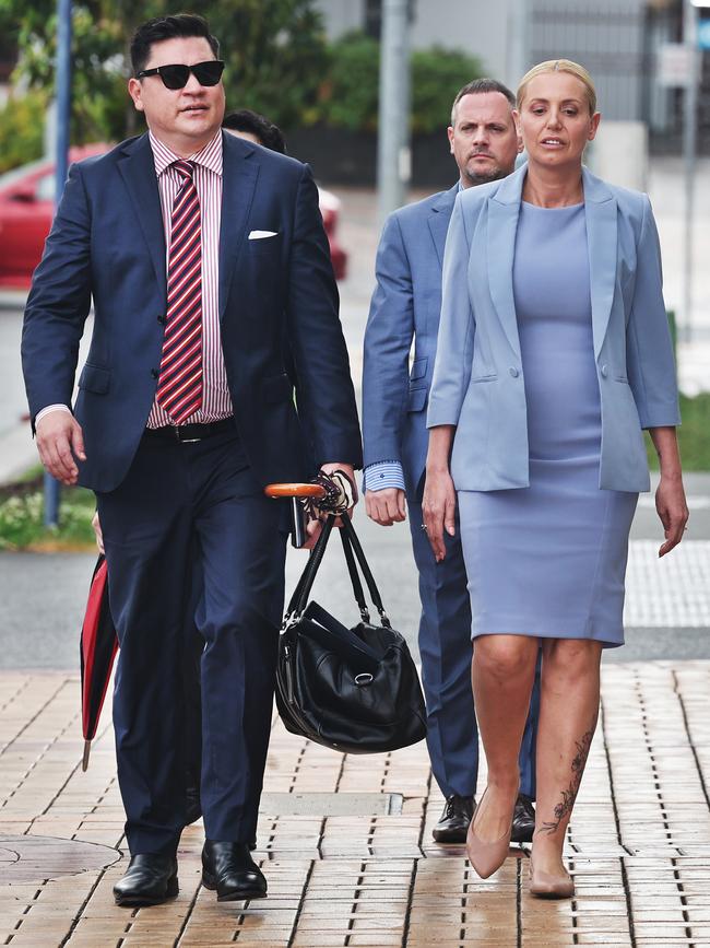 Prominent restaurateurs Steve Adams ( following behind ) and Autumn Adams appeared at Southport court today for the first time since being charged with cocaine-related offences. They arrived at court alongside lawyer Ron Behlau (left). Picture Glenn Hampson