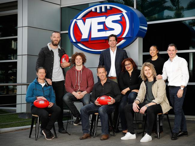 Collingwood AFLW player Meg Hutchins, Melbourne’s Max Gawn, North Melbourne’s Ben Brown, Hawthorn coach Alastair Clarkson, AFL CEO Gillon McLachlan, AFL general manager of inclusion and social policy Tanya Hosch, Essendon’s Dyson Heppell, Carlton AFLW player Darcy Vescio and AFL Umpires Association coach Hayden Kennedy pose for a photograph outside AFL House. Picture: AAP