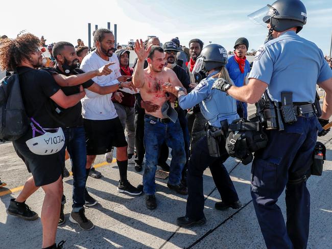 Protesters hand over the driver of a tanker truck in Minneapolis, Minnesota. Picture: Reuters