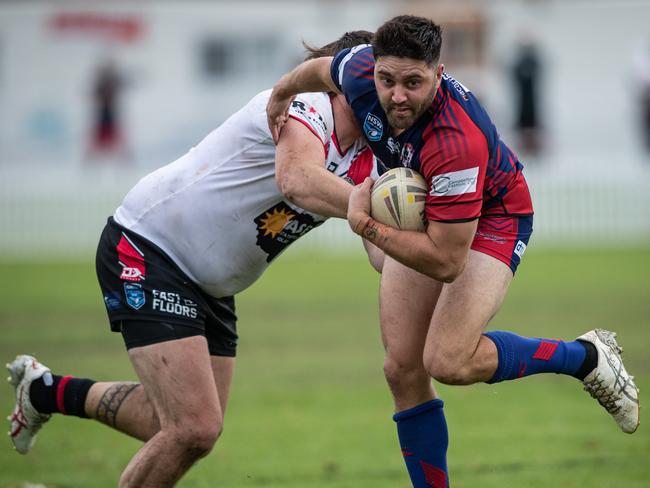 2nd April 2023. News Local.Sport. Campbelltown, Sydney, NSW, Australia.Action pics from Macarthur Rugby League,First Grade: Campbelltown Collegians (blue) v Oakdale Workers (white) at Bradbury Oval, Campbelltown.Collegians Leon Longbottom tackled by Nathan Davis.Pics by Julian Andrews.