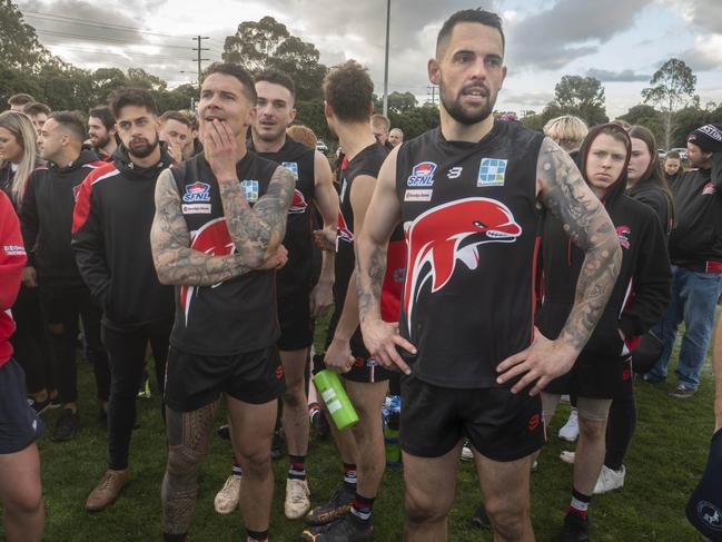 Frankston Dolphins playing-coach Rich Mathers (right) after the grand final defeat. Picture: Valeriu Campan