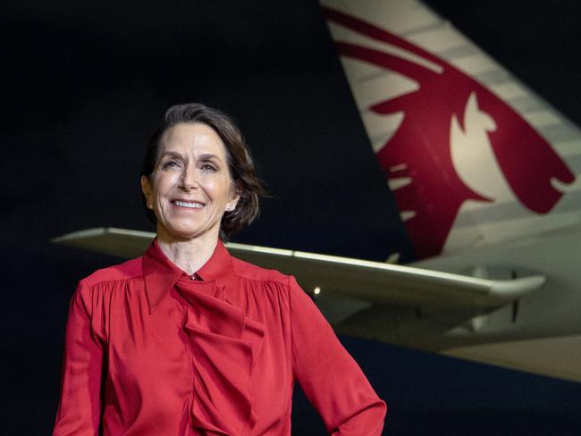 BRISBANE, AUSTRALIA - DECEMBER 04: In this image released on December 12, Jayne Hrdlicka, CEO of Virgin Australia, stands on the apron beside a Qatar Airways Boeing 777 at Brisbane Airport on December 04, 2024 in Brisbane, Australia. A new partnership between the two airlines has been launched which will deliver more value and choice to Australians, providing opportunities to travel to over 100 destinations across Europe, the Middle East and Africa. From December 12, Aussies can book Virgin Australia's new direct services from Sydney, Brisbane and Perth to Doha for travel from June 2025, with Melbourne set to launch later in 2025. These flights will be operated by Virgin Australia using Qatar Airways' spacious Boeing 777s, renowned for their Qsuite Business Class. (Photo by James D. Morgan/Getty Images for Virgin Australia)