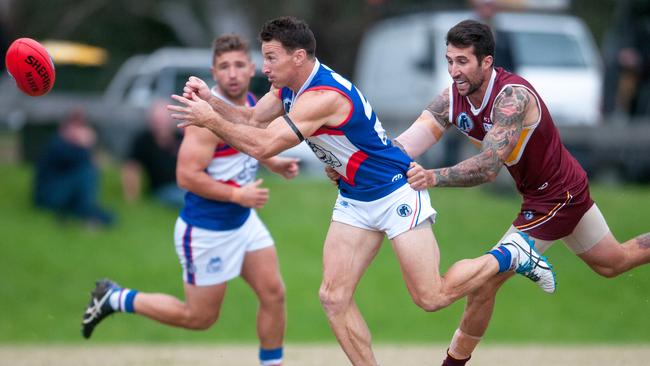 North Heidelberg's Brent Harvey dishes out a handball against Lower Plenty. Picture: Christopher Chan