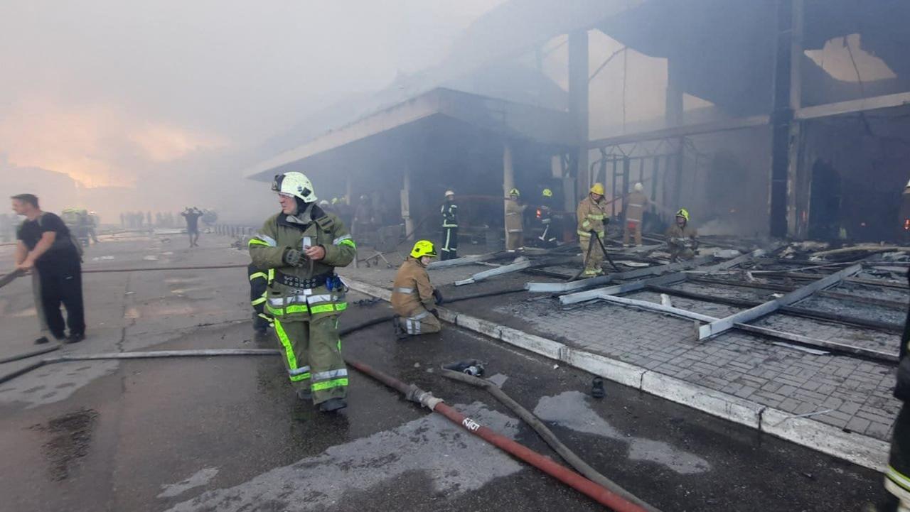 Firefighters putting out the fire in a mall hit by a Russian missile strike in the eastern Ukrainian city of Kremenchuk. Picture: AFP