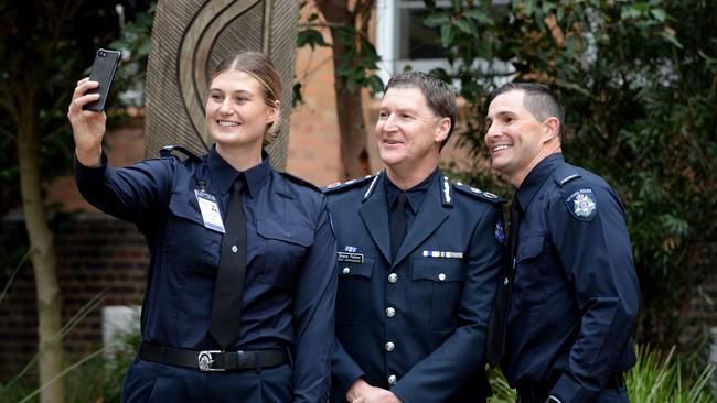 Police Chief Commissioner Shane Patton with Victoria Police 2021 recruits Adelaide Sheriff and Nigel Lee. Picture: NCA NewsWire / Andrew Henshaw