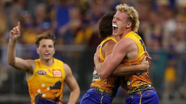 PERTH, AUSTRALIA - MAY 19: Reuben Ginbey of the Eagles celebrates a goal with teammates during the 2024 AFL Round 10 match between Waalitj Marawar (West Coast Eagles) and Narrm (Melbourne Demons) at Optus Stadium on May 19, 2024 in Perth, Australia. (Photo by Will Russell/AFL Photos via Getty Images)