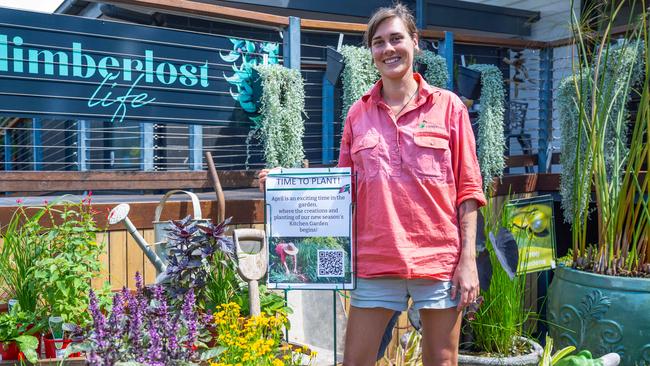 Limberlost Garden centre employee Elle Ryan with a selection of herbs set to thrive with the cooler weather. Photo by Emily Barker