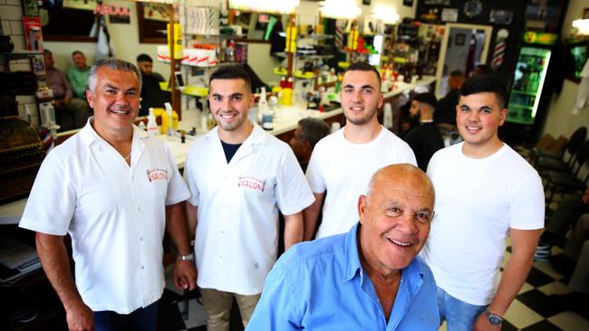 Abdul, Bill, Sam, and Kanga Kandakji with grandfather Kamil Kandakji in the foreground at Bankstown Barber Salon. Picture: Angelo Velardo