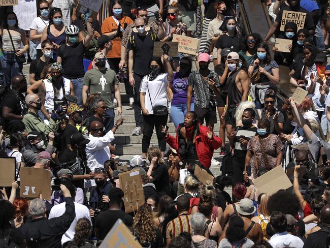 People gather in London’s Trafalgar Square last week. Picture: AP