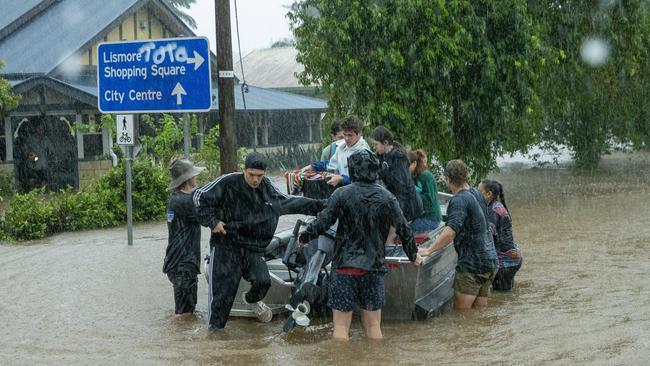 Residents and pets are rescued on the edge of Lismore CBD. Picture: Media Mode