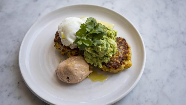 The corn fritters with smashed avo. Picture: Mark Cranitch.