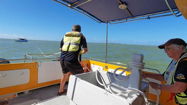 Coast Guard crew Merv Studt (left) and Marjorie Roth (right) handling the tow line after a boat broke down on Sunday. Picture: Yeppoon Coast Guard