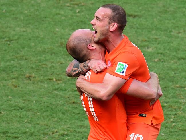 Netherlands' forward Arjen Robben (left) celebrates with Wesley Sneijder their victory at the end of a Round of 16 football match between Netherlands and Mexico. AFP PHOTO/ JAVIER SORIANO