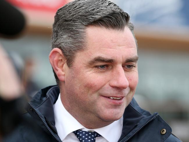 Trainer Clinton McDonald is seen after jockey Damien Oliver rode Benitoite to victory in race 6, Jenna Ross VOBIS Gold Reef during the Bletchingly Stakes Day at Caulfield Racecourse in Melbourne, Saturday, July 27, 2019. (AAP Image/George Salpigtidis) NO ARCHIVING, EDITORIAL USE ONLY