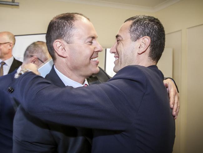 It was all fine before the presser ... Josh Frydenberg hugs Tom Koutsantonis. Picture: Mike Burton